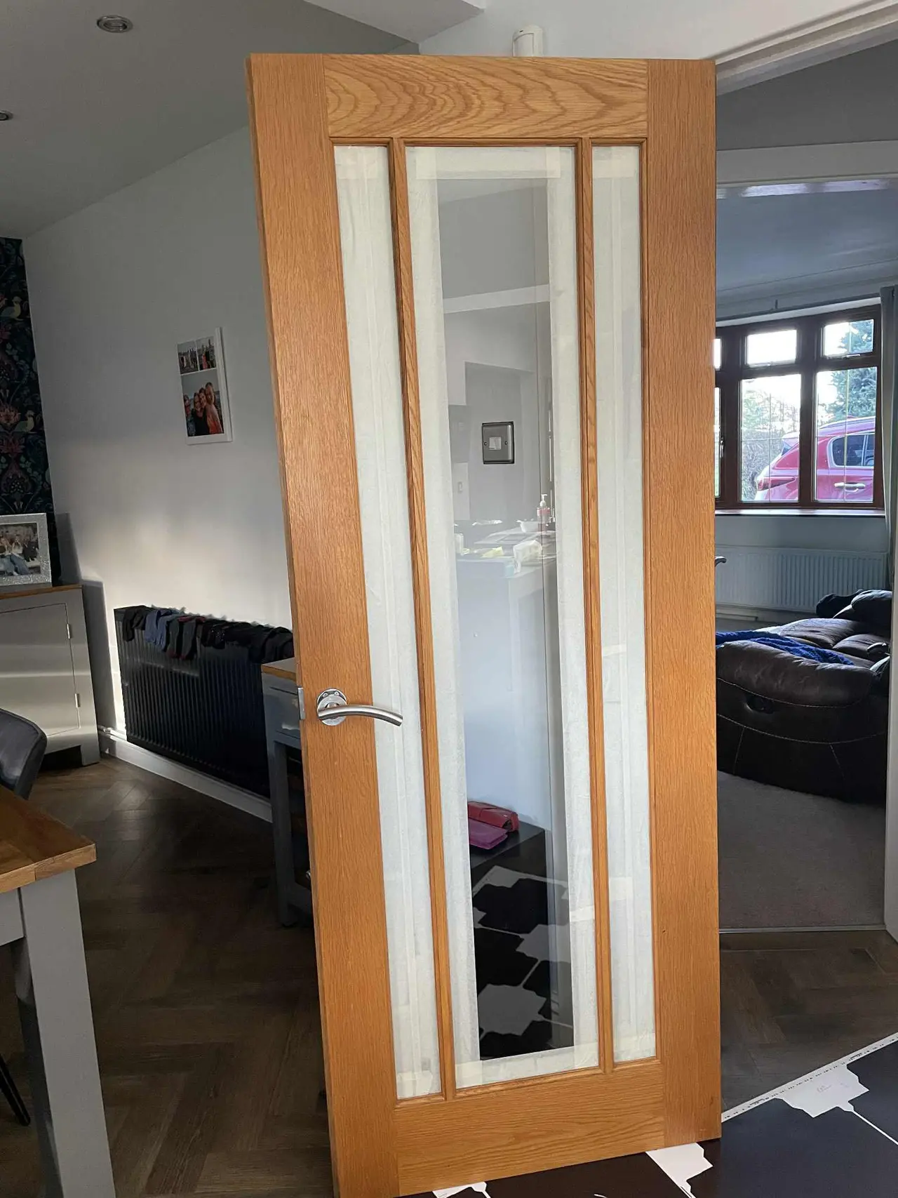 Oak interior door installation with glass panels